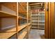 Unfinished basement with wooden shelving, providing ample storage space for an organized home at 1129 Annie Sw Ln, Mableton, GA 30126