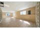 Finished basement with built in shelving and natural light creating an open and adaptable space at 1129 Annie Sw Ln, Mableton, GA 30126