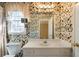 Charming bathroom featuring unique wallpaper, vanity with sink and a window that allows for natural light at 1129 Annie Sw Ln, Mableton, GA 30126