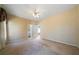 Spacious carpeted bedroom featuring neutral walls, ceiling fan, bathroom and closet access at 1129 Annie Sw Ln, Mableton, GA 30126