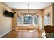 Bright dining area with a window seat, large windows and hardwood flooring at 1129 Annie Sw Ln, Mableton, GA 30126