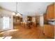 Spacious kitchen area features an island, hardwood floors, and built-in wooden cabinets at 1129 Annie Sw Ln, Mableton, GA 30126