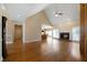 Bright living room featuring hardwood floors, a cozy fireplace, and vaulted ceilings at 1129 Annie Sw Ln, Mableton, GA 30126