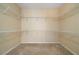 Empty walk-in closet with carpet and wire shelving offering ample storage at 1129 Annie Sw Ln, Mableton, GA 30126
