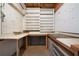 Organized workshop area featuring a pegboard, open shelving, and built-in workbenches at 1129 Annie Sw Ln, Mableton, GA 30126