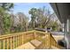 View of the backyard with mature trees and a wood deck at 1282 Westridge Sw Rd, Atlanta, GA 30311