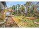 Backyard view with a small deck and grassy yard at 1282 Westridge Sw Rd, Atlanta, GA 30311