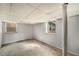 Unfinished basement with concrete floors and two windows providing natural light at 1282 Westridge Sw Rd, Atlanta, GA 30311