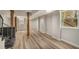 Finished basement with modern flooring, exposed beams, and stairs to the upper floor at 1282 Westridge Sw Rd, Atlanta, GA 30311