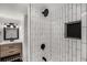 Bathroom featuring modern vanity, updated tiling and fixtures in the shower at 1282 Westridge Sw Rd, Atlanta, GA 30311