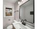 Beautiful bathroom with a modern vanity, large mirror, and walk-in shower with tiled walls at 1282 Westridge Sw Rd, Atlanta, GA 30311