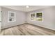 Bedroom featuring modern flooring and two windows for ample natural light at 1282 Westridge Sw Rd, Atlanta, GA 30311