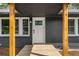 Inviting front porch with natural wood accents and updated black brick exterior at 1282 Westridge Sw Rd, Atlanta, GA 30311