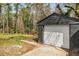 Detached one car garage in backyard with new roof and door at 1282 Westridge Sw Rd, Atlanta, GA 30311