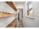 Charming hallway features wood benches, floating shelves and a view of the kitchen ahead at 1282 Westridge Sw Rd, Atlanta, GA 30311
