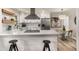 Modern kitchen featuring white cabinets, stainless steel appliances, and an eat-in bar at 1282 Westridge Sw Rd, Atlanta, GA 30311