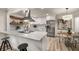 Modern kitchen featuring white cabinets, stainless steel appliances, and an eat-in bar at 1282 Westridge Sw Rd, Atlanta, GA 30311