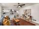 Inviting living room open to a kitchen featuring stylish decor, light wood floors, and modern ceiling fan at 1282 Westridge Sw Rd, Atlanta, GA 30311