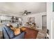 Open-concept living room with a view to the kitchen, light wood floors, and stylish decor at 1282 Westridge Sw Rd, Atlanta, GA 30311