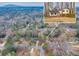 An aerial view of a cozy home in a well-maintained neighborhood with mature trees at 1417 Hickory Sw Dr, Lilburn, GA 30047