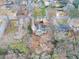 Aerial view of a charming home featuring mature trees and a driveway at 1417 Hickory Sw Dr, Lilburn, GA 30047