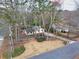 Aerial view of a home with mature landscaping, showcasing its neighborhood setting and curb appeal at 1417 Hickory Sw Dr, Lilburn, GA 30047
