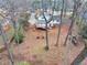 View of a two-story home with a wooden deck, stairs, and a landscaped backyard at 1417 Hickory Sw Dr, Lilburn, GA 30047