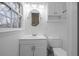 Clean bathroom featuring white fixtures, a vanity, and ample natural light at 1417 Hickory Sw Dr, Lilburn, GA 30047