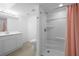 Bathroom featuring shower over tub and an updated vanity at 1417 Hickory Sw Dr, Lilburn, GA 30047
