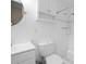 Bright bathroom with updated fixtures, a round mirror, and a combined shower and tub at 1417 Hickory Sw Dr, Lilburn, GA 30047