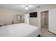 Inviting bedroom with a large TV, plush carpeting, and neutral walls at 1417 Hickory Sw Dr, Lilburn, GA 30047
