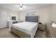 Bright bedroom with a vanity, soft lighting, and a neutral color palette at 1417 Hickory Sw Dr, Lilburn, GA 30047