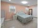 Bedroom featuring a comfortable bed, lots of light, and ample storage at 1417 Hickory Sw Dr, Lilburn, GA 30047