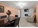Comfortable dining room with ample seating, great lighting, and stone fireplace at 1417 Hickory Sw Dr, Lilburn, GA 30047