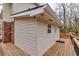 Home's exterior view showcasing its design, attached deck and natural surroundings at 1417 Hickory Sw Dr, Lilburn, GA 30047