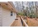 Exterior view showing the deck, with mature trees in the background at 1417 Hickory Sw Dr, Lilburn, GA 30047