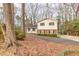 Charming two-story home with a blend of siding and brick and a long driveway at 1417 Hickory Sw Dr, Lilburn, GA 30047