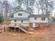 Exterior showcasing a deck, stairs, and backyard at 1417 Hickory Sw Dr, Lilburn, GA 30047