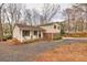 Well-maintained two-story home with a welcoming front porch, ideal for outdoor seating at 1417 Hickory Sw Dr, Lilburn, GA 30047