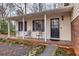 Cozy front porch featuring seating and a welcoming entrance, perfect for relaxing and enjoying the outdoors at 1417 Hickory Sw Dr, Lilburn, GA 30047