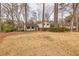 Two-story home showcasing a well-maintained front yard and inviting curb appeal at 1417 Hickory Sw Dr, Lilburn, GA 30047