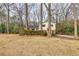 Traditional two-story home on a spacious lot with mature trees and landscaping at 1417 Hickory Sw Dr, Lilburn, GA 30047