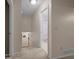 Hallway with carpeted floors, neutral color, and views of doorways leading into other rooms at 1417 Hickory Sw Dr, Lilburn, GA 30047