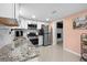 Modern kitchen features stainless steel appliances and granite countertops at 1417 Hickory Sw Dr, Lilburn, GA 30047
