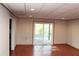 Finished basement with laminate floors, a sliding glass door to outside, and neutral walls at 2335 Corbett Ct, Powder Springs, GA 30127