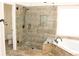 Luxurious bathroom with glass-enclosed shower and soaking tub at 2335 Corbett Ct, Powder Springs, GA 30127