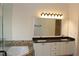 Bathroom with double vanity and an ornate mirror at 2335 Corbett Ct, Powder Springs, GA 30127