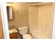 Bathroom with wood cabinet sink, toilet and shower and white walls at 2335 Corbett Ct, Powder Springs, GA 30127