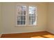 Bedroom with wood floors and window at 2335 Corbett Ct, Powder Springs, GA 30127