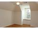 Bedroom with wood floors, ceiling fan, and window with bench at 2335 Corbett Ct, Powder Springs, GA 30127